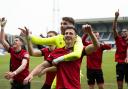 St Mirren players celebrate with supporters in Dundee
