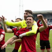 St Mirren players celebrate with supporters in Dundee