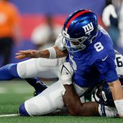 New York Giants quarterback Daniel Jones fumbles the ball as he is tackled by Seattle Seahawks defensive end Mario Edwards Jr (Adam Hunger/AP)