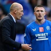 Rangers manager Philippe Clement, left, speaks to John Lundstram on the touchline during a game this season