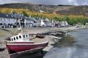 Fishing boat in the Ullapool harbour, Ross and Cromarty, Scottish Highlands, Scotland, UK. (Photo by: Arterra/Universal Images Group via Getty Images).