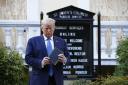Donald Trump holds a Bible as he visits outside St. John's Church across Lafayette Park from the White House Monday, June 1, 2020