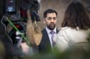 Humza Yousaf speaks to the media while on the campaign trail for SNP leadership