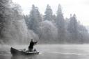 An angler casts a line on the opening day of the salmon fishing season on the River Tay