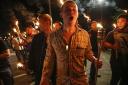 White nationalist groups march with torches through the UVA campus in Charlottesville, Virginia