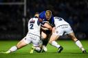 James Tracy of Leinster is tackled by Ross Ford, left, and Simon Berghan in Dublin