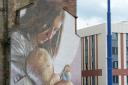 Smug's mural of Thaney and her son Mungo, at the corner of Glasgow's High Street, conveys a message about finding refuge in the city