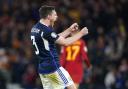 Scotland's Andrew Robertson celebrates following the UEFA Euro 2024 qualifying group A match at Hampden Park against Spain