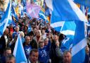 Pro-independence supporters march through Edinburgh, during the All Under One Banner march
