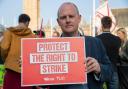General Secretary of the Trade Union Congress of UK Paul Nowak holds up sign calling to Protect The Right To Strike