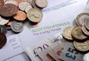 A letter from Scottish Power surrounded by money
