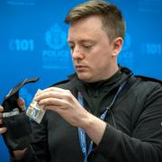 Police Scotland's PC Ross Hunter shows the media a naloxone nasal spray that all officers across Scotland will carry and to be instructed in the use. Photo: PA