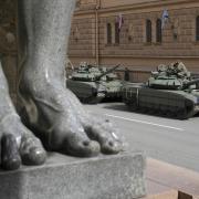 In advance of the Victory Day military parade taking place tomorrow, soldiers have been preparing their Russian T-72 tanks by the feet of a famous sculpture of Atlas at the State Hermitage museum in St Petersburg