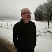 Dennis Canavan former MP & MSP now convenor of the Ramblers Association pictured in the Stirlingshire countryside with views in thye distance where the Beauly - Denny power runs 26/2/10.