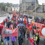 People take part in the Scotland Demands a Pay Rise march and rally organised by the STUC in Edinburgh yesterday