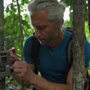 Tim van Deursen from Hack the Planet installing an AI-enabled camera trap in Gabon