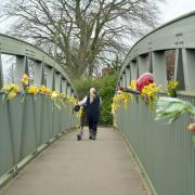 Flowers on a bridge pay tribute after the body of missing mother Nicola Bulley was found last week