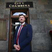 Edinburgh Council leader Cammy Day has clung to power despite being forced to vote through an opposition budget