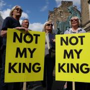Anti-monarchy protesters outside St Giles' Cathedral in Edinburgh
