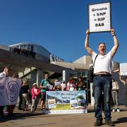 Short-term let landlords protest outside the Scottish Parliament