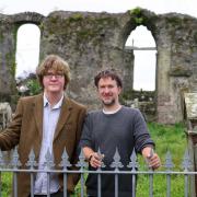 Shaun Bythell (left) and Ben Please at the Martyrs’ Graves in the town’s graveyard.