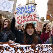 GLASGOW, SCOTLAND - OCTOBER 28: Climate protesters march through the city centre  on October 28, 2022 in Glasgow, Scotland. The march was timed to mark the anniversary of the COP26 climate summit, held in Glasgow last year. The protesters called the COP