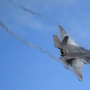 An F-35 Lightning stealth jet performs a flypast during the commissioning ceremony for 809 Naval Air Squadron at RAF Marham in King's Lynn in Norfolk