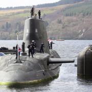 A submarine is shown docking at Faslane in a handout photo from the Ministry of Defence