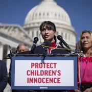 WASHINGTON, DC - SEPTEMBER 20: Chloe Cole speaks as Rep. Marjorie Taylor Greene (R-GA) looks on during a news conference on Capitol Hill September 20, 2022 in Washington, DC. Greene discussed her legislation named the Protect Childrens Innocence Act,