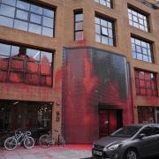 Labour HQ was drenched in red paint (above)