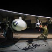 An RAF technician works on a Typhoon jet in a photo issued by the MoD