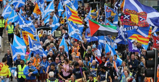 Scottish independence supporters march as part of an All Under One Banner event