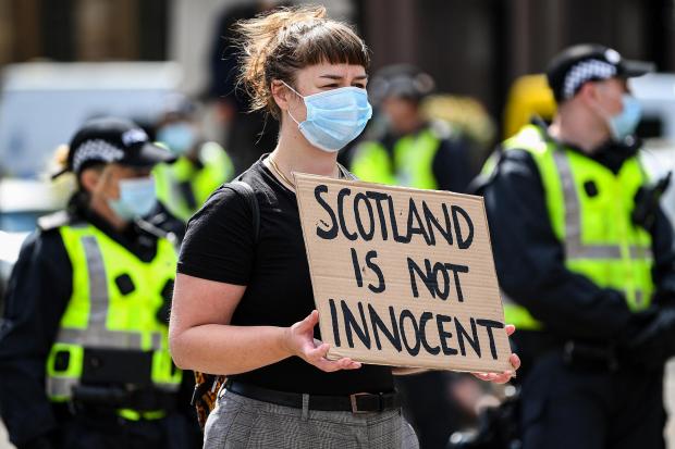 GLASGOW, UNITED KINGDOM - JUNE 20:  People participate in a Black Lives Matter demonstration in George Square on June 20, 2020 in Glasgow, Scotland. Black Lives Matter protests are continuing across the UK following the death of African American George