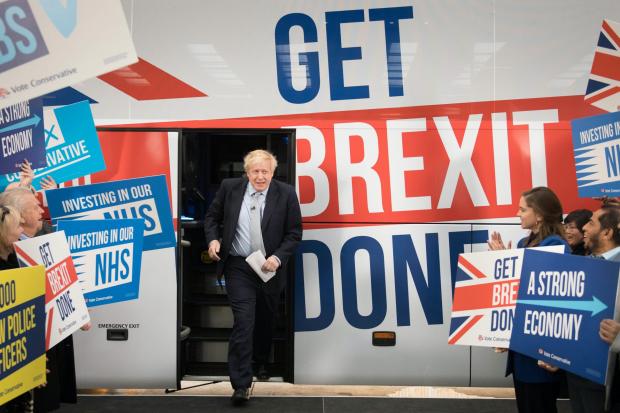 The National: Boris Johnson next to the slogan 'Get Brexit Done' on the Tory election battlebus