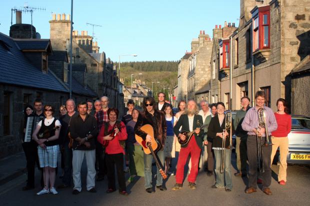Mike Scott of The Waterboys with local singers and musicians who took part in a community performance of Room to Roam as it became Huntly’s ‘anthem’