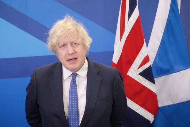 Boris Johnson spoke remotely at the Scottish Tory conference in front of a Saltire, neatly tucked behind a Union flag