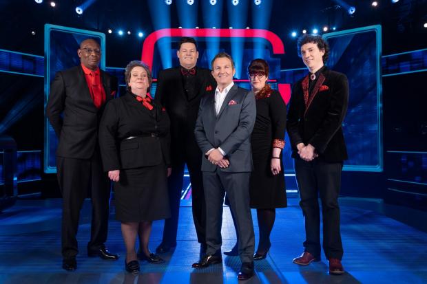 The National: Bradley Walsh, centre, with The Chase quiz masters