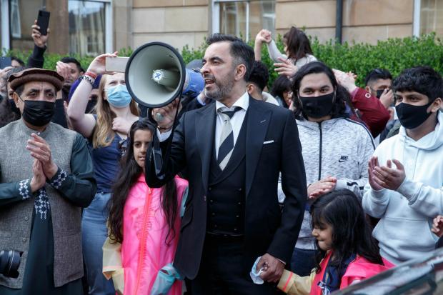 Aamer Anwar negotiated the release of two men detained in a van after a Home Office raid