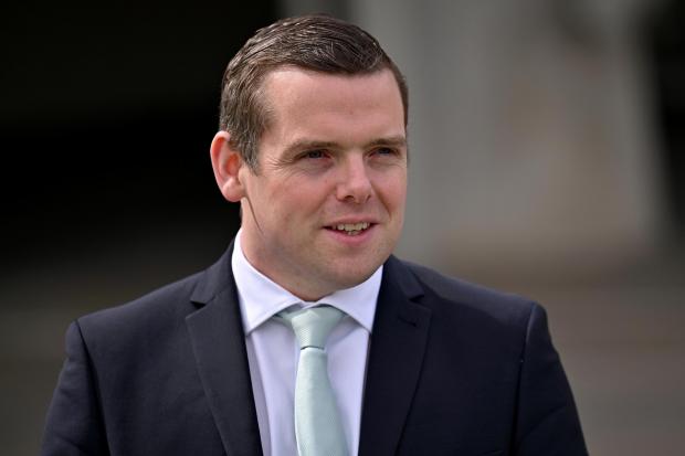 The National: EDINBURGH, SCOTLAND - MAY 09: Scottish Conservative party leader Douglas Ross poses for a photograph outside the Scottish Parliament on May 09, 2021 in Edinburgh, Scotland. The party picked up two new seats to offset the loss of two seats, leaving its