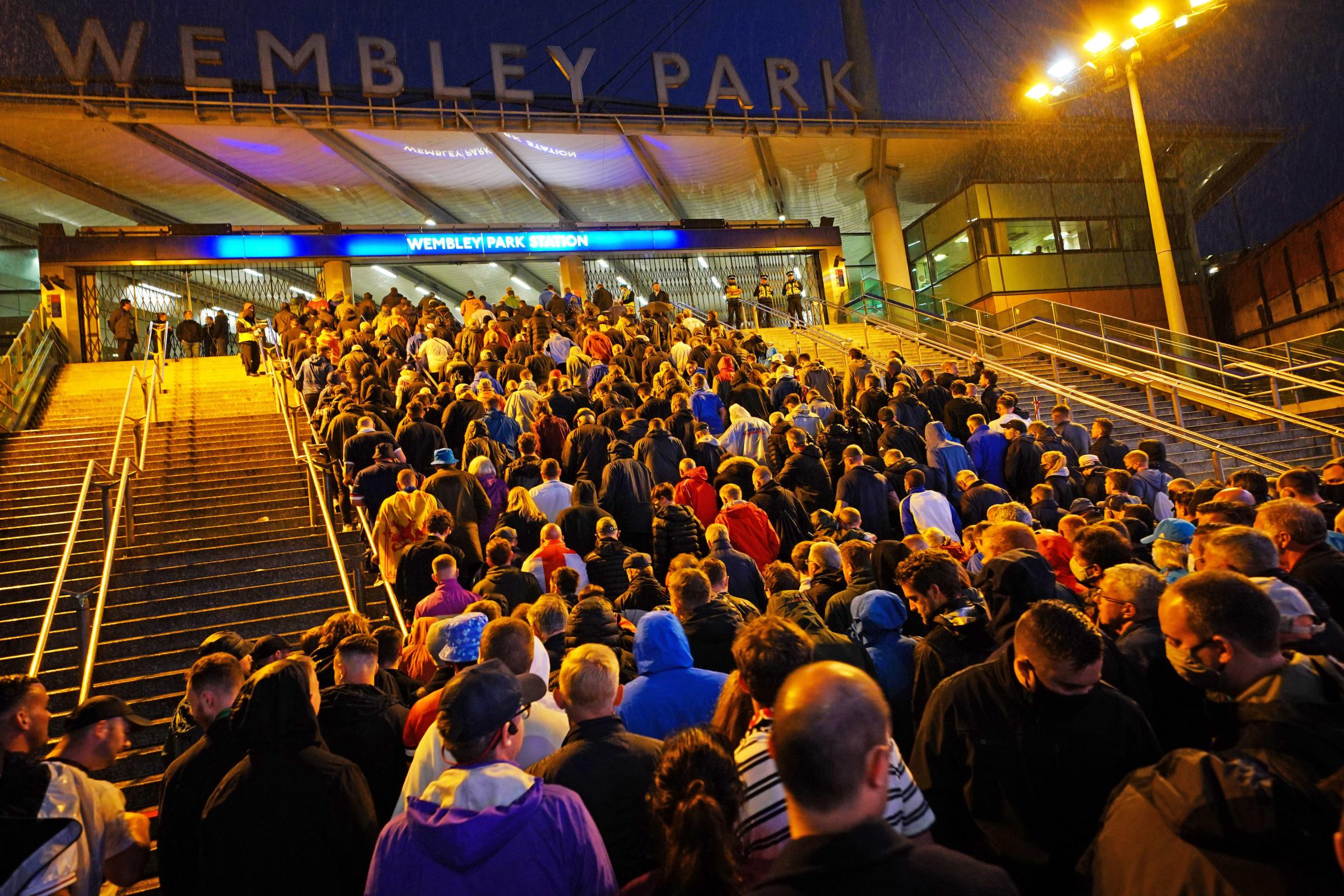 Fans leave Wembley Stadium after the UEFA Euro 2020 Group D match between England and Scotland. Picture date: Friday June 18, 2021. PA Photo. See PA story SOCCER England. Photo credit should read: Aaron Chown/PA Wire..