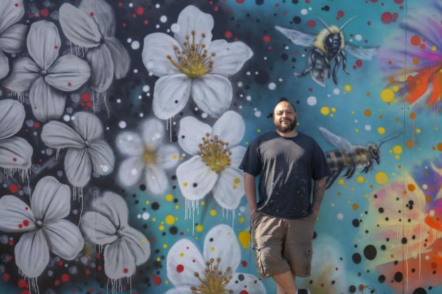 Danny McDermott, also known as EJEK, has created a bespoke mural to adorn the hoardings around CALA Homes (West)’s Prince’s Quay development