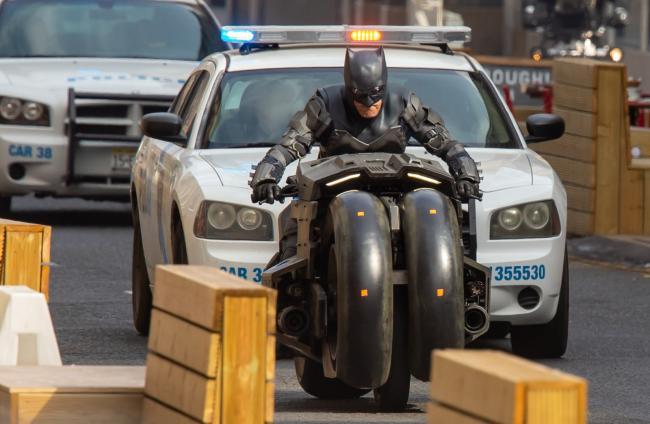 Ben Affleck's stunt double rides through Glasgow on the Batmobile. Photograph: Colin Mearns
