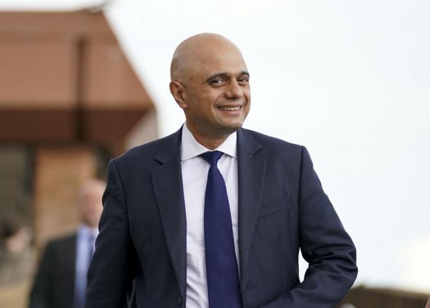 The National: Health Secretary Sajid Javid talks to staff during a visit to the Bournemouth Vaccination Centre, in Bournemouth, on August 4. Picture: PA