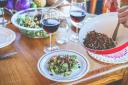 A vegan salad and red wines