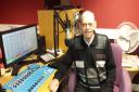 Retired journalist Bill Marwick reads the news to blind listeners