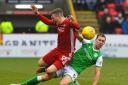 Steven Whittaker challenges Aberdeen's Lewis Ferguson