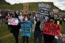 People take part in a Black Lives Matter protest rally at Holyrood Park, in Edinburgh