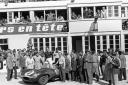 The victorious Ecurie Ecosse team with winners Flockhart and Ninian Sanderson and the Jaguar D-Type