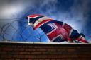 A Union Jack flag tangled in barbwire in Glasgow