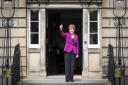 Nicola Sturgeon gives a thumbs-up on the steps of Bute House after the 2021 election result